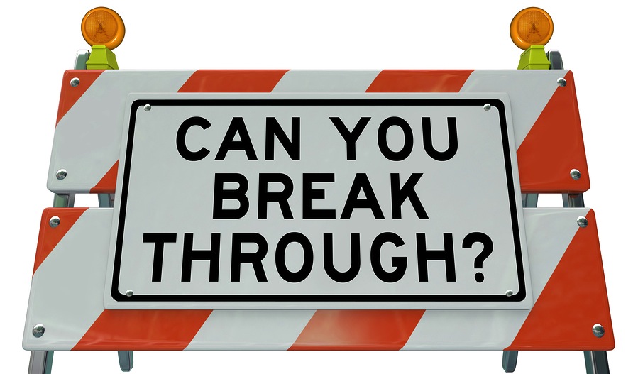 Image of a barrier with the words CAN YOU BREAK THROUGH